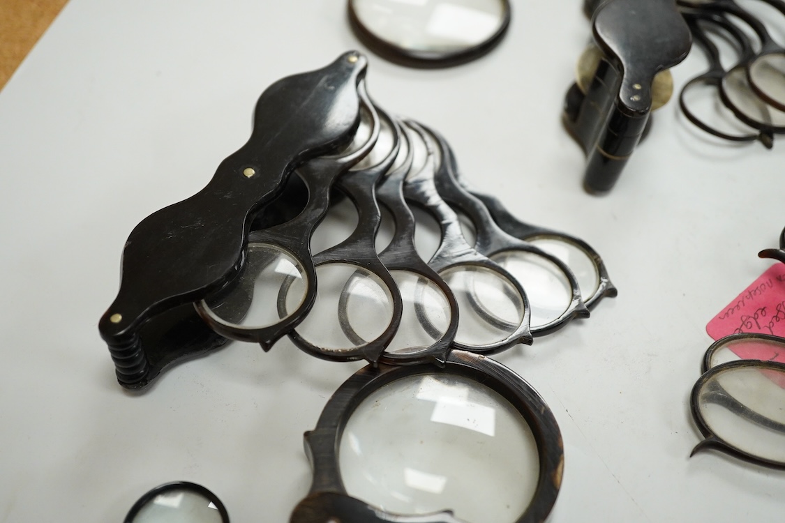 A group of 19th-century horn framed loupes, quizzing glasses and four optician multiple lens sizing lorgnettes (13)